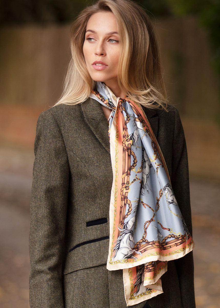 Classic Knot, Drape your scarf around your neck with one end slightly longer than the other to tie a rectangle or classic scarf.